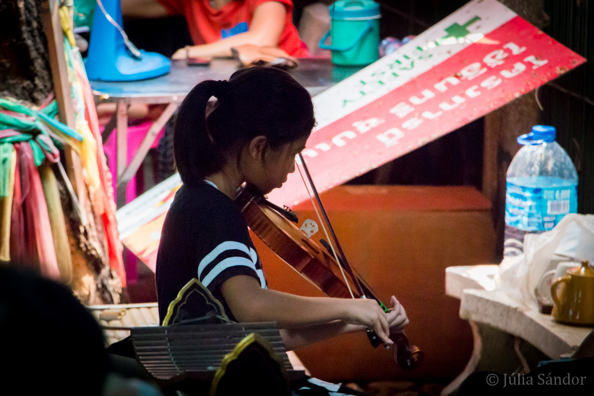 Faces of Asia: Violin playing girl in Bangkok