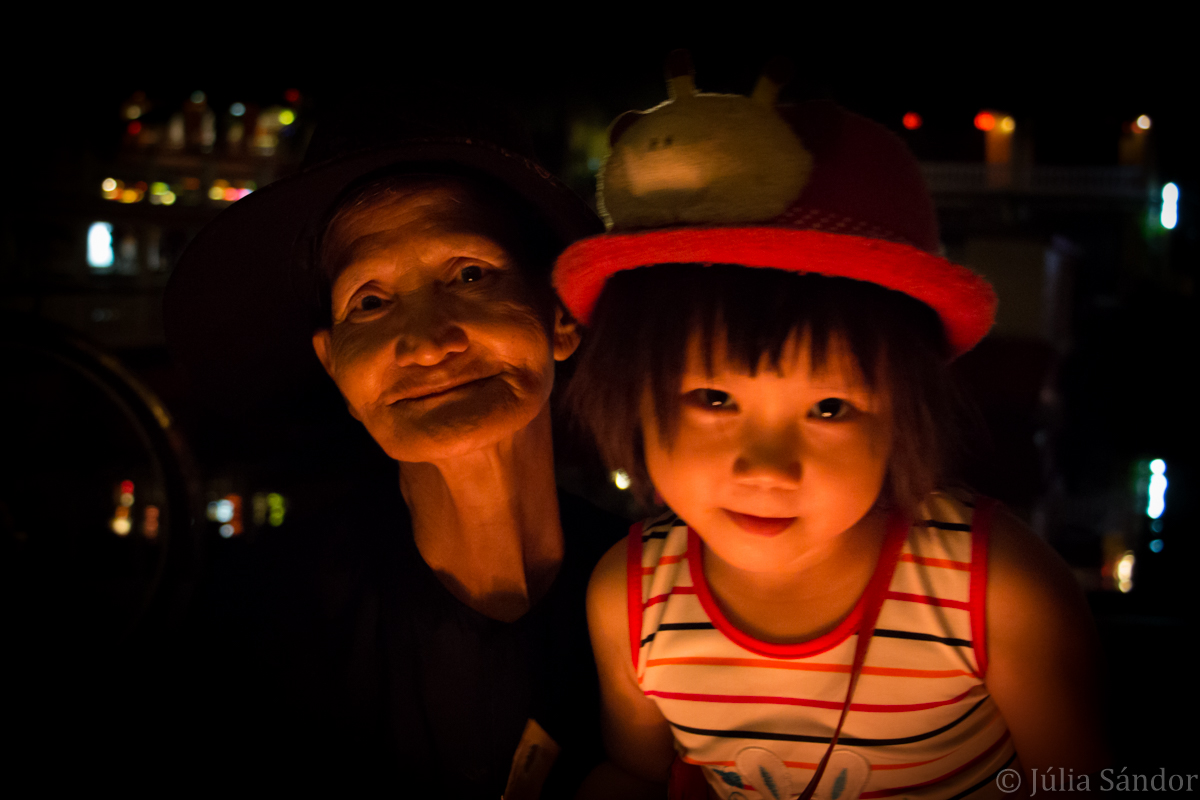 Faces of Asia: Lantern vendor lady with her granddaughter