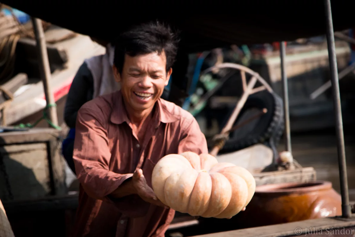 Vietnam-Mekong-floating-market-man-faces-of-the-world-juliasanphotography Faces of Asia: Pumpkin vendor in the floating market