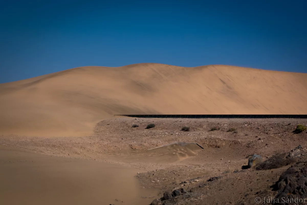 Railway running into dune
